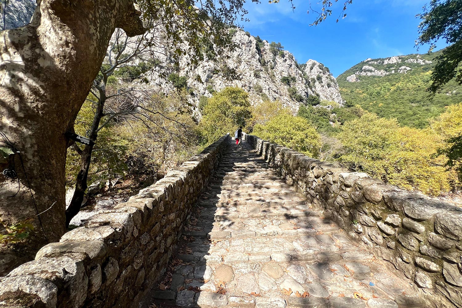 charming-stone-path-on-top-of-the-Portaikos-Bridge